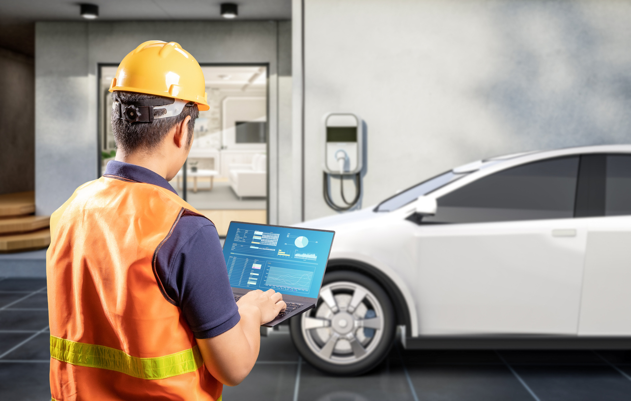 Asian engineer or technician install home ev charger